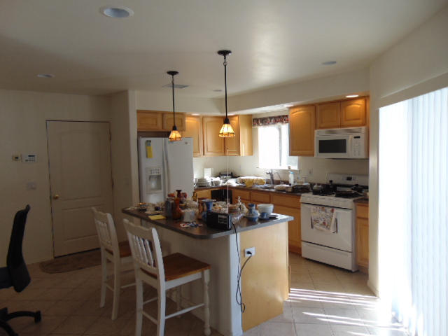 3545 East Rimrock Drive Rimrock, AZ 86335 - Photo 7 of 19 a kitchen with sink a stove and chairs