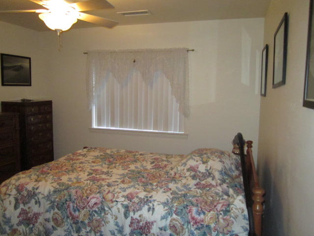 3545 East Rimrock Drive Rimrock, AZ 86335 - Photo 10 of 19 a bedroom with a bed and a dresser
