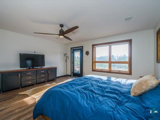5508 Nordling Road Duluth, MN 55804 - Photo 16 of 58 Bedroom featuring access to outside, wood finished floors, and a ceiling fan