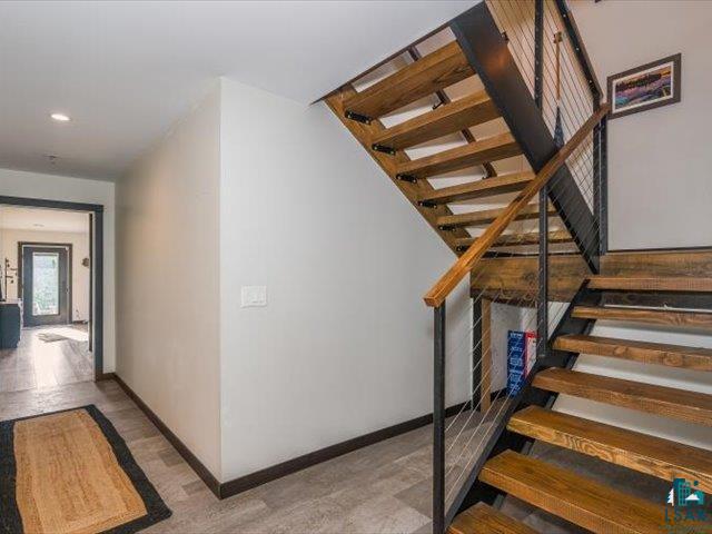 5508 Nordling Road Duluth, MN 55804 - Photo 19 of 58 Stairway featuring baseboards and recessed lighting