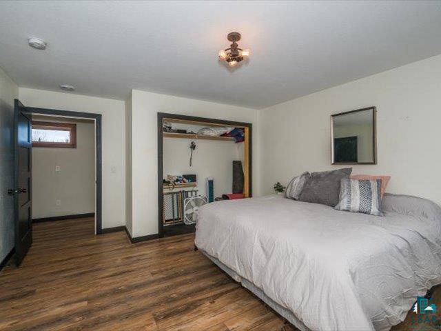 5508 Nordling Road Duluth, MN 55804 - Photo 24 of 58 Bedroom with dark wood finished floors and a closet