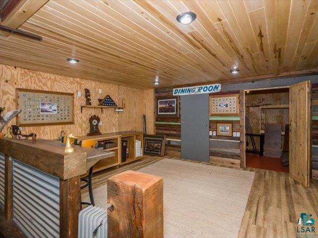 5508 Nordling Road Duluth, MN 55804 - Photo 36 of 58 Upper level of Barn with wood walls, wooden ceiling, and wood finished floors
