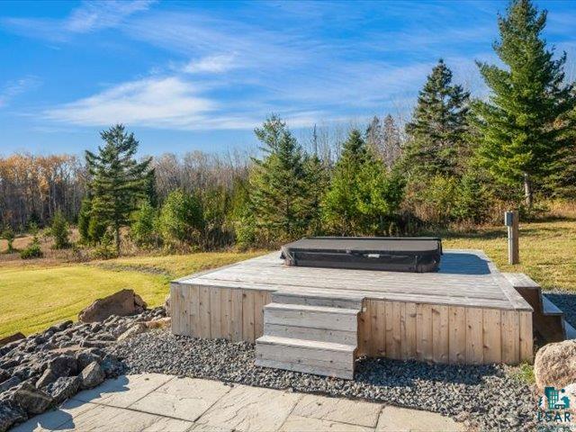 5508 Nordling Road Duluth, MN 55804 - Photo 56 of 58 View of patio featuring a covered hot tub and a wooded view