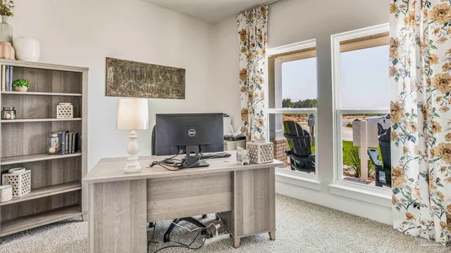 a room with furniture a rug and a window