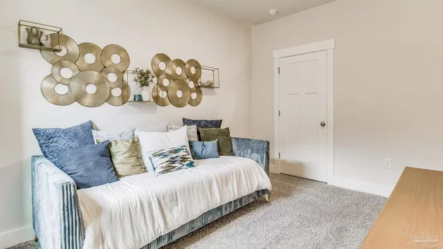 a bedroom with a bed and a couch