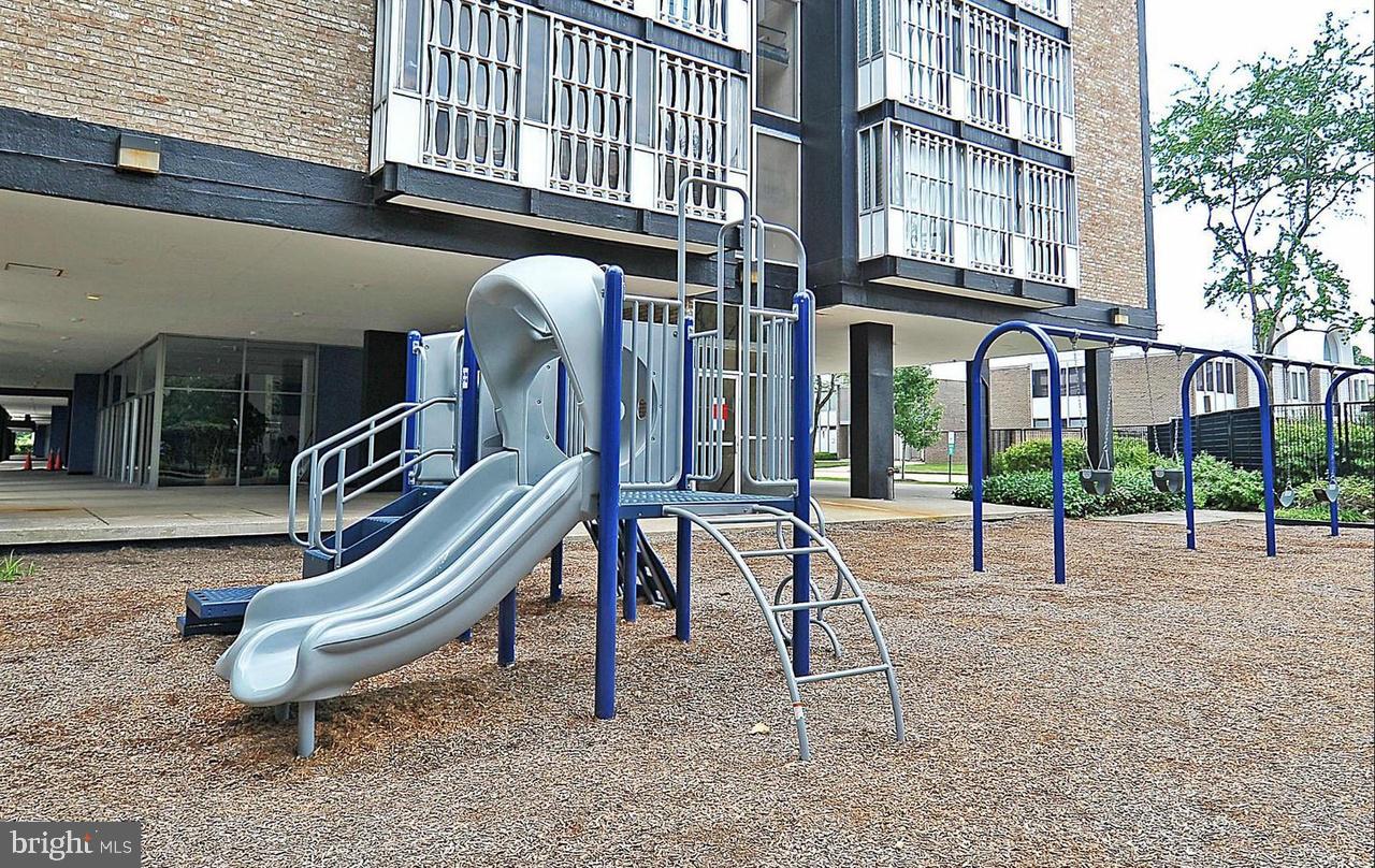 1340 4th Street Southwest, Unit T1340 Washington, DC 20024 - Photo 19 of 40 a view of a building with a park bench