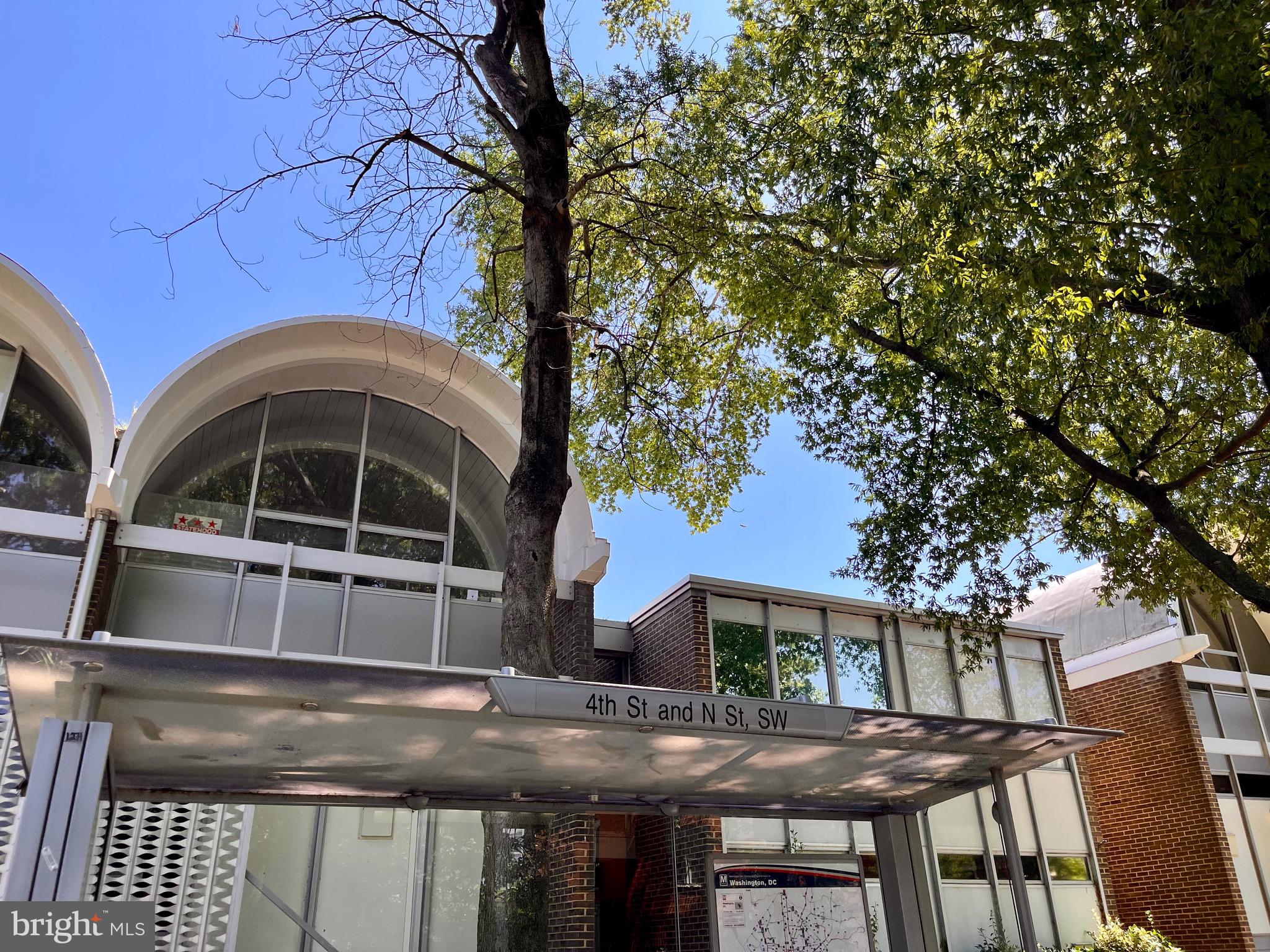 1340 4th Street Southwest, Unit T1340 Washington, DC 20024 - Photo 26 of 40 a front view of a house with a yard