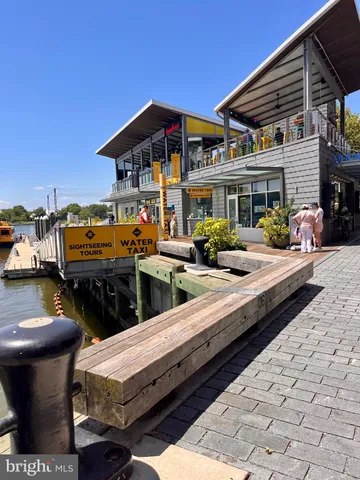 a view of a balcony with two chairs and a potted plant