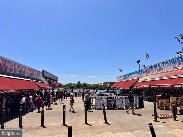 a view of entrance gate with a building in the background