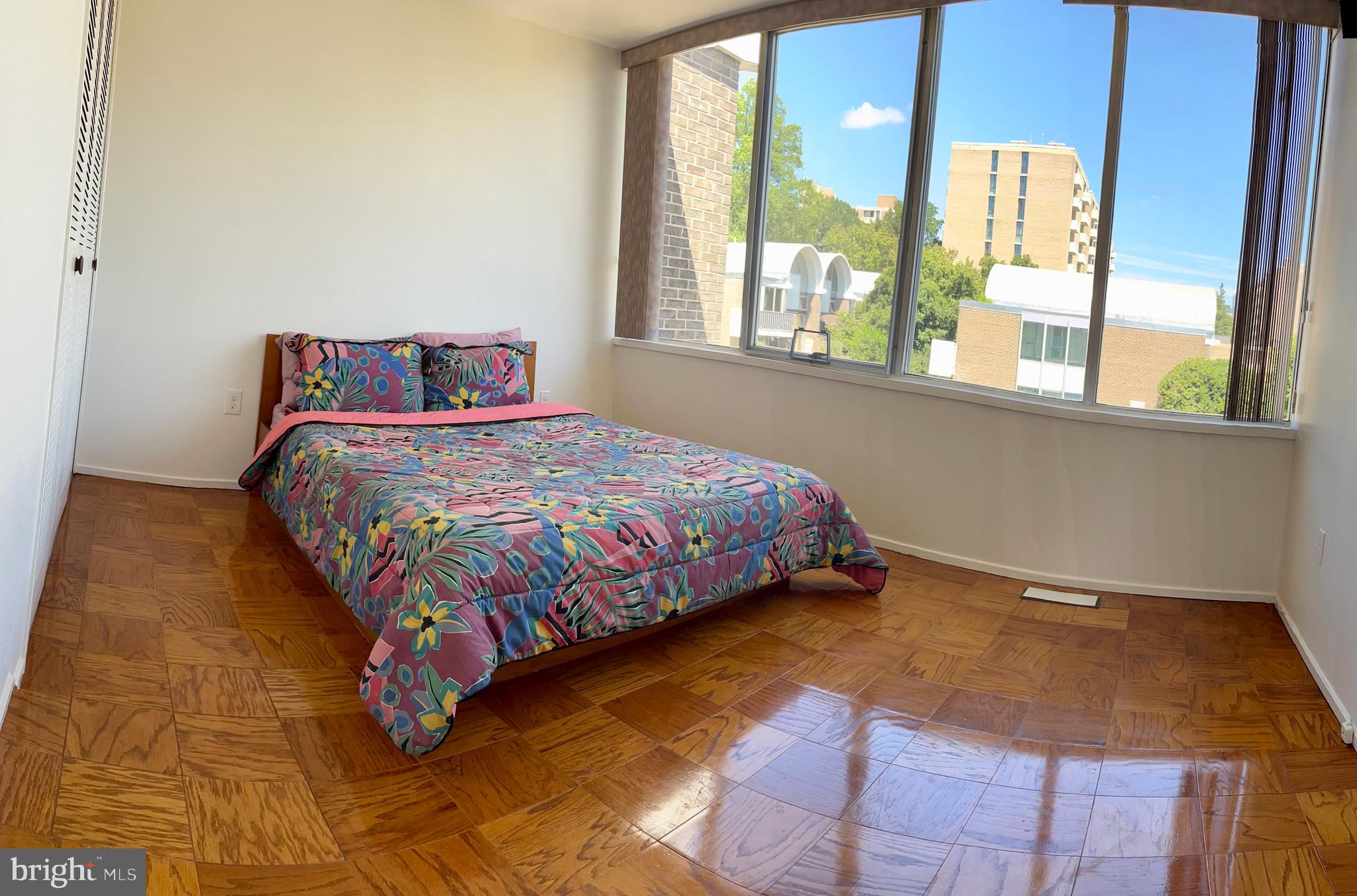 1340 4th Street Southwest, Unit T1340 Washington, DC 20024 - Photo 10 of 40 a bedroom with a bed and window