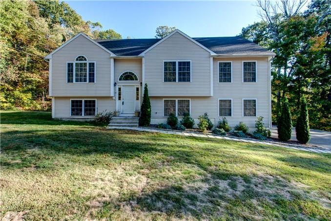 170 Mohegan Road Shelton, CT 06484 - Photo 1 of 1 a front view of a house with a yard