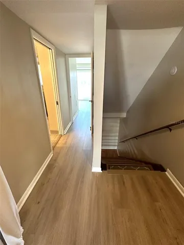 a view of a room with wooden floor and chair