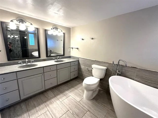 a bathroom with a bathtub and shower