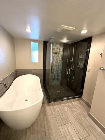 a view of front door with wooden floor and stairs