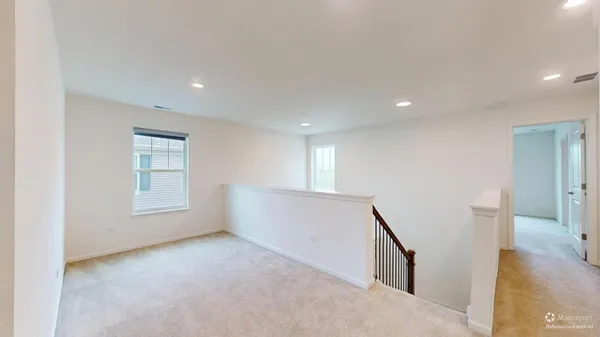 a view of room with window and stairs
