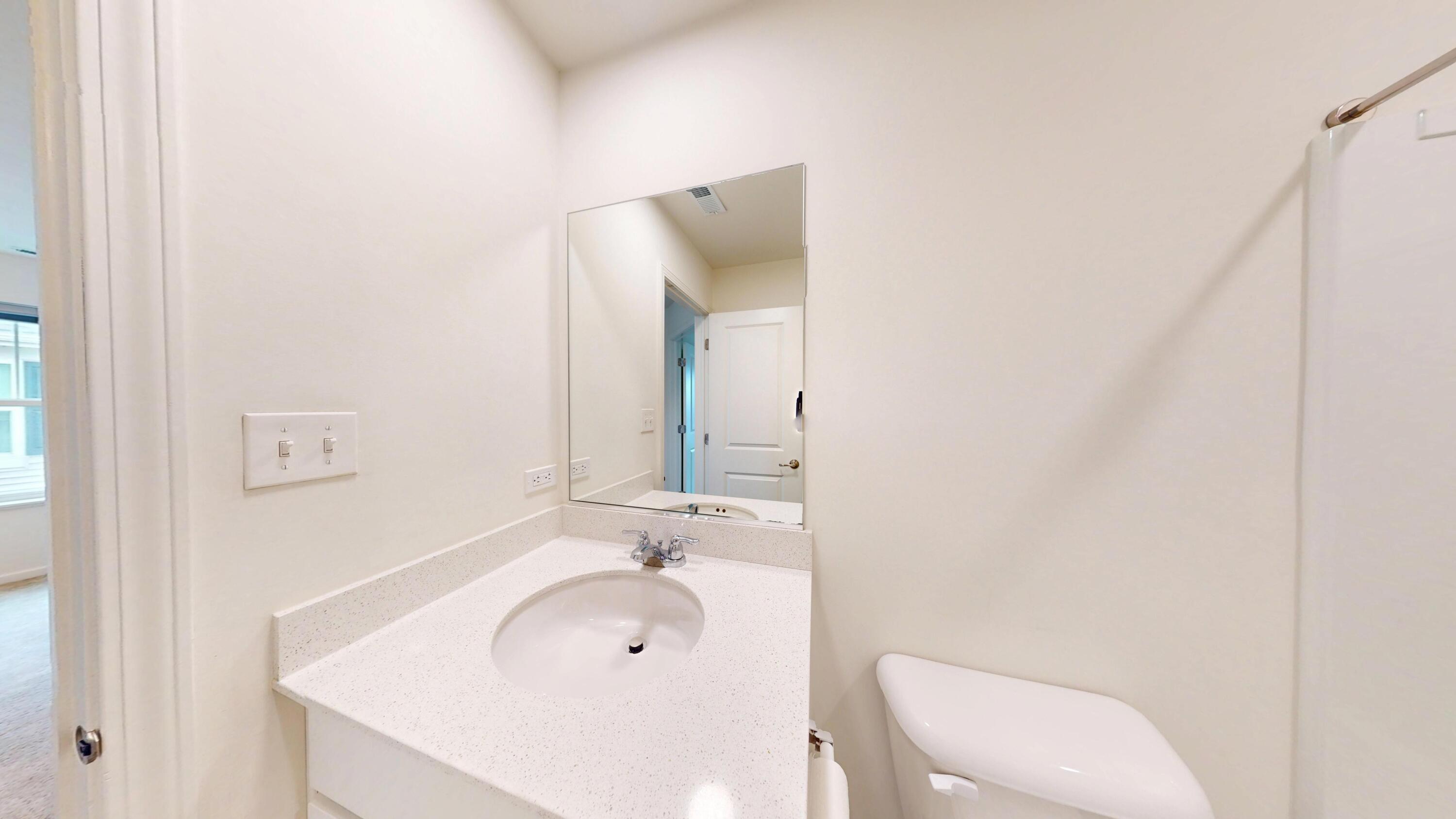 1832 East 110th Lane Crown Point, IN 46307 - Photo 18 of 20 a bathroom with a sink a toilet and mirror