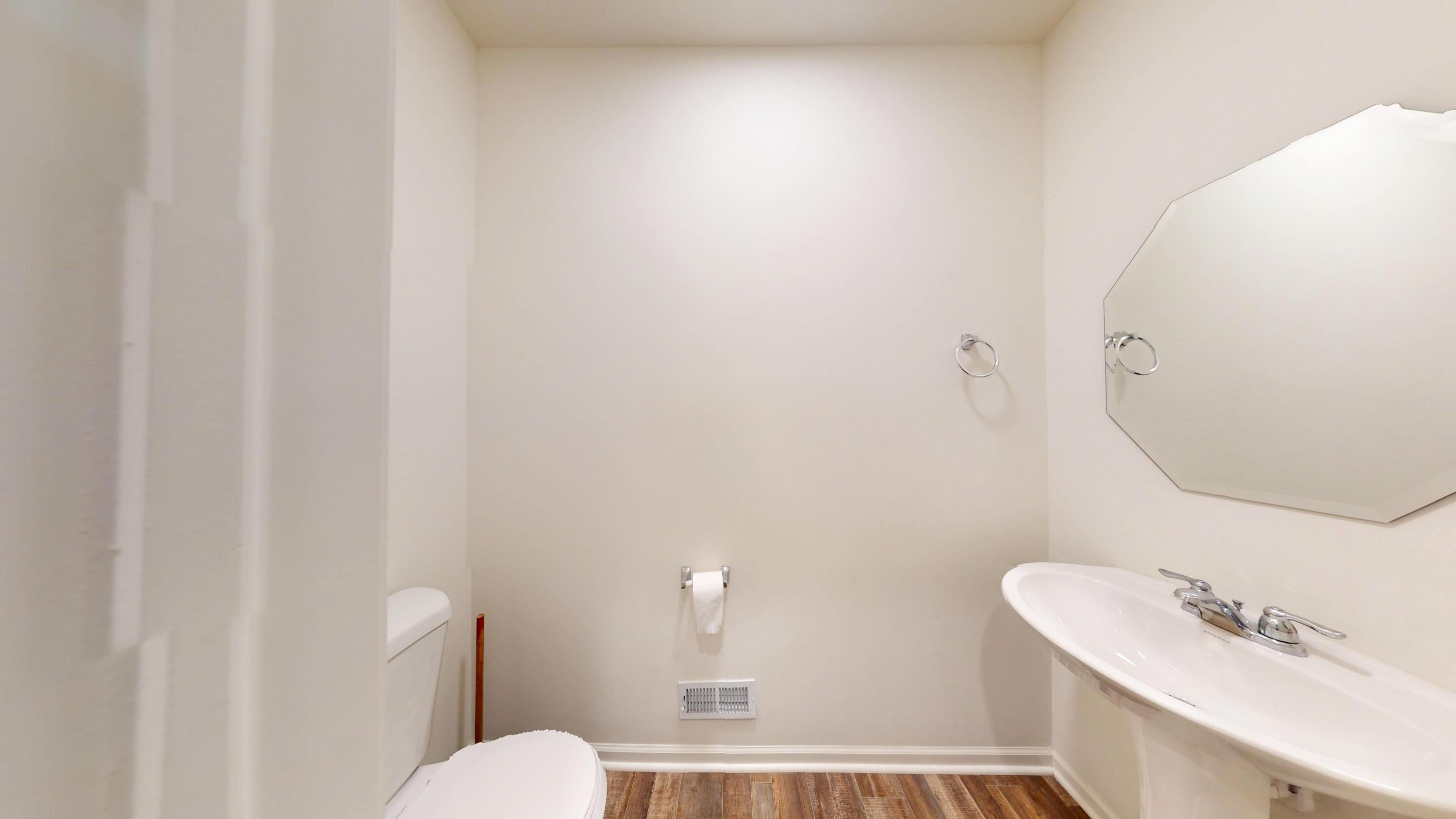 1832 East 110th Lane Crown Point, IN 46307 - Photo 20 of 20 a bathroom with a sink a toilet and a mirror