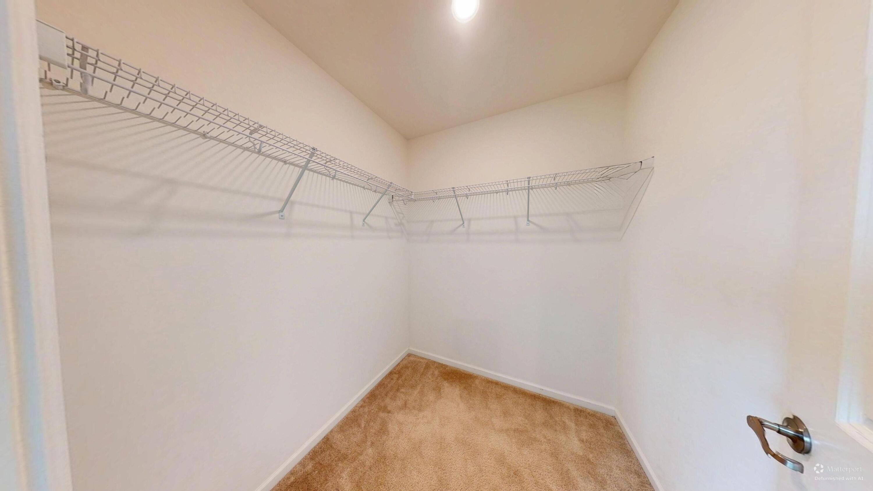 1832 East 110th Lane Crown Point, IN 46307 - Photo 5 of 20 a view of a room with racks on the wall