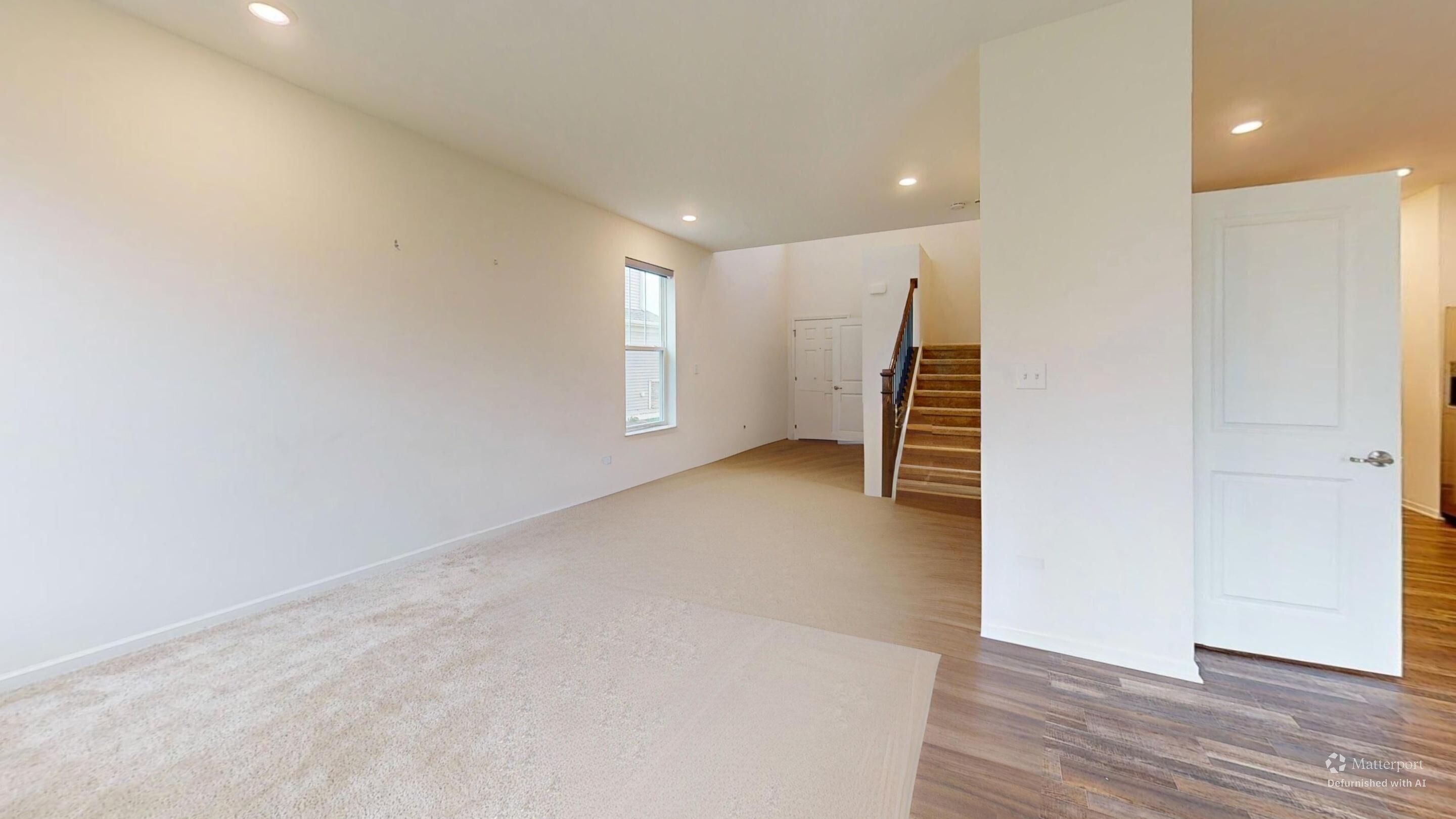1832 East 110th Lane Crown Point, IN 46307 - Photo 9 of 20 a view of an empty room with wooden floor and windows