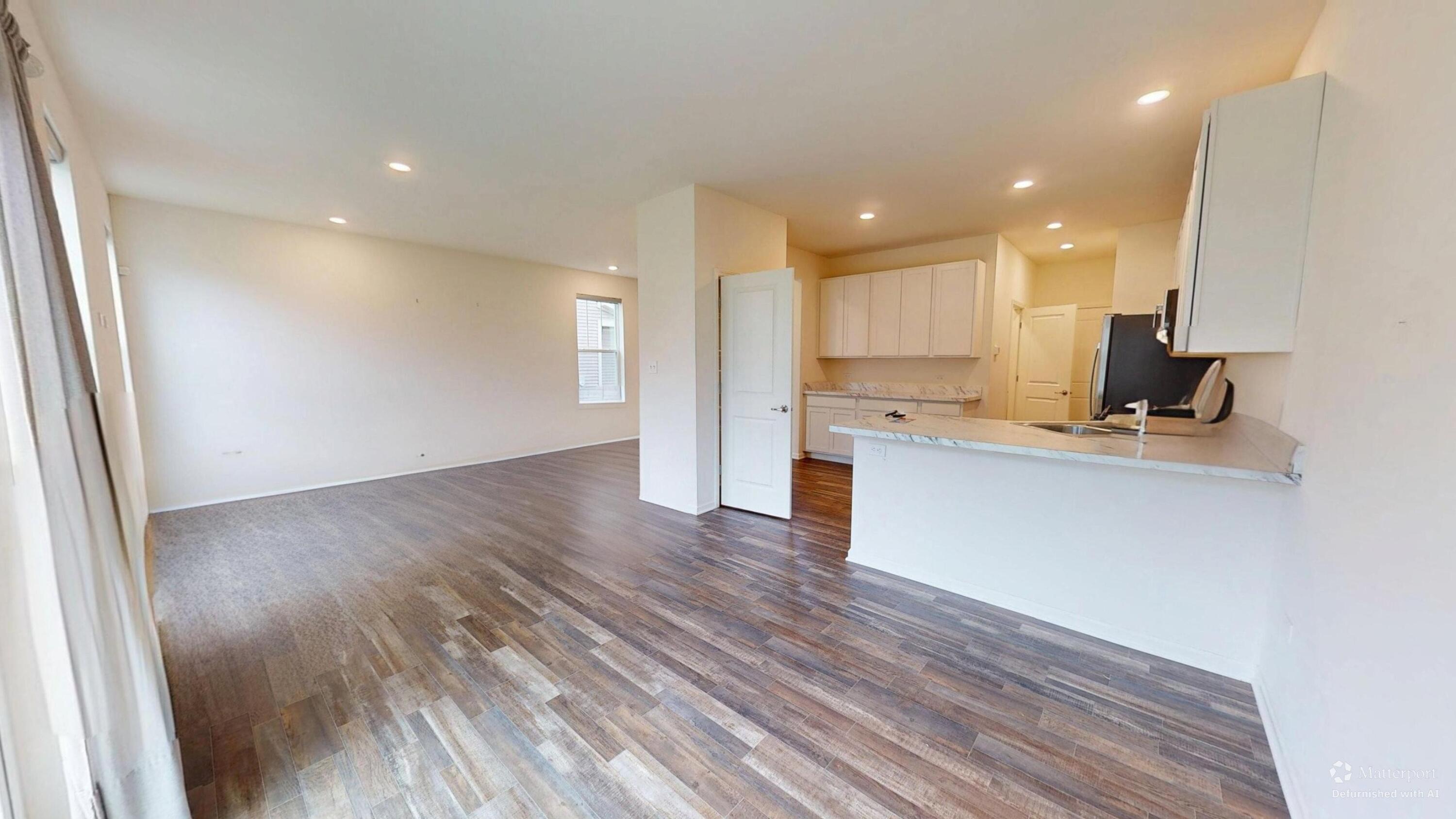 1832 East 110th Lane Crown Point, IN 46307 - Photo 10 of 20 a view of kitchen with cabinets stainless steel appliances and wooden floor