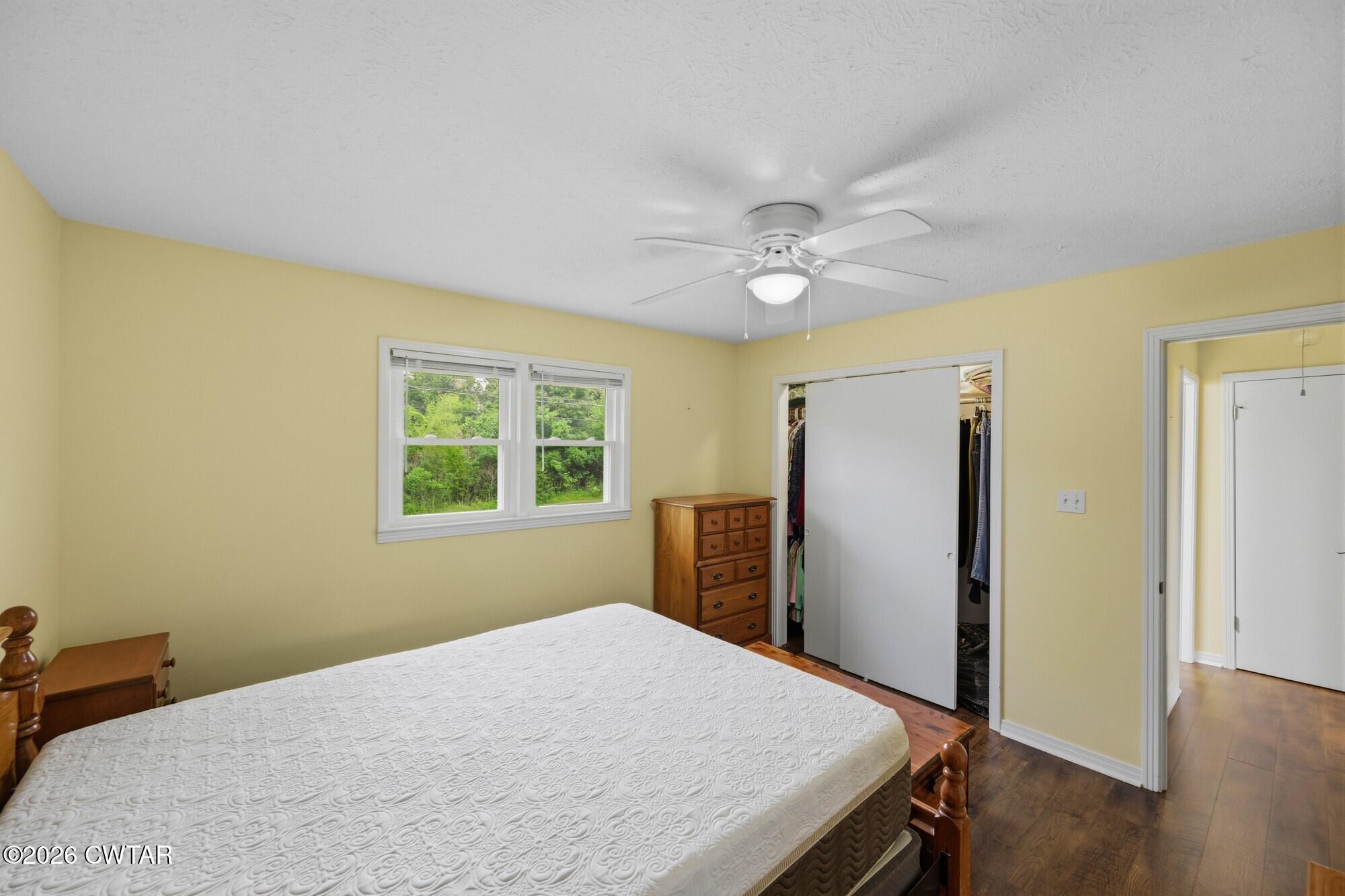 944 Brooksie Thompson Road Decaturville, TN 38329 - Photo 25 of 47 a bedroom with a bed and a window