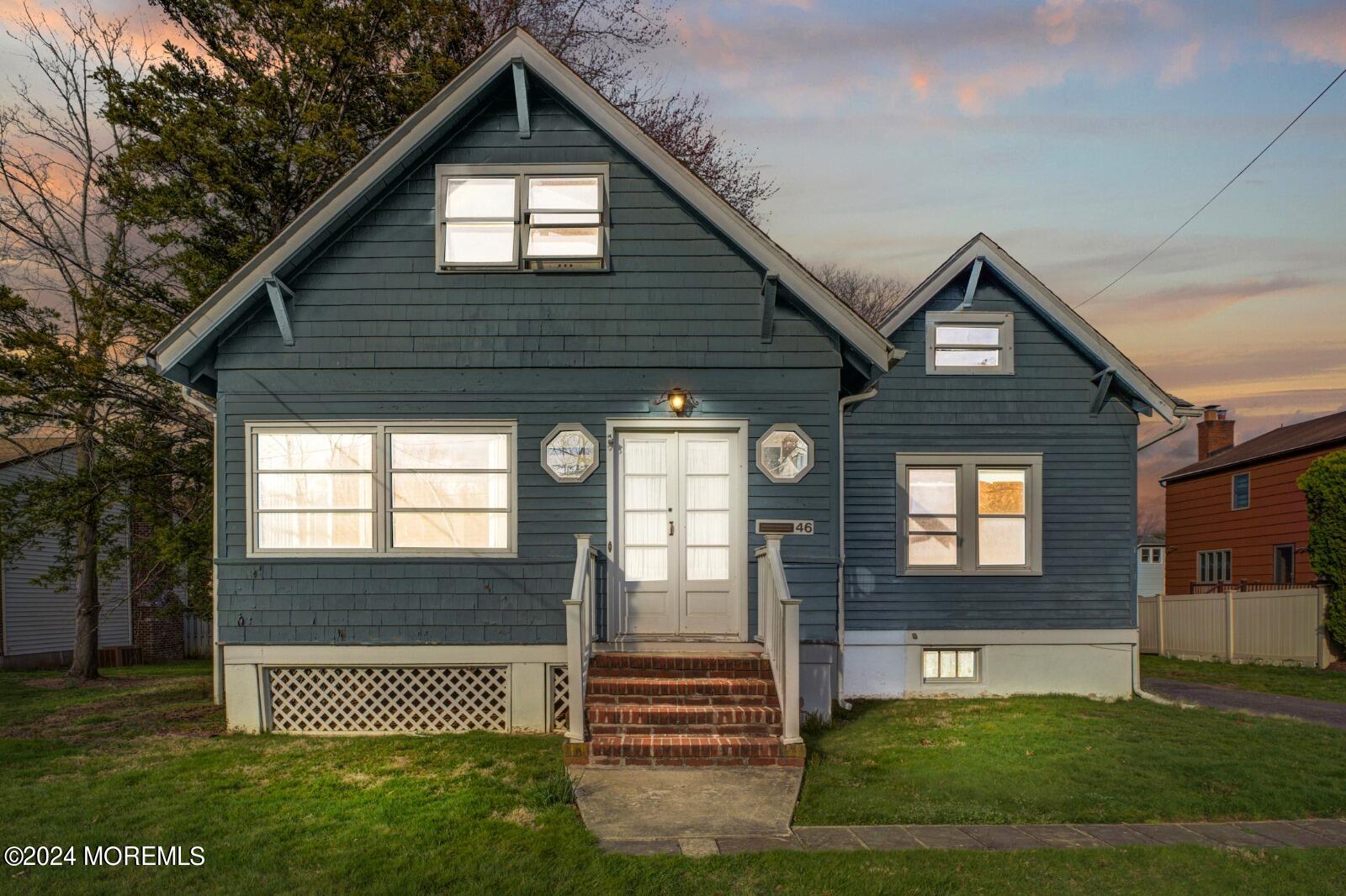 a front view of a house with a yard