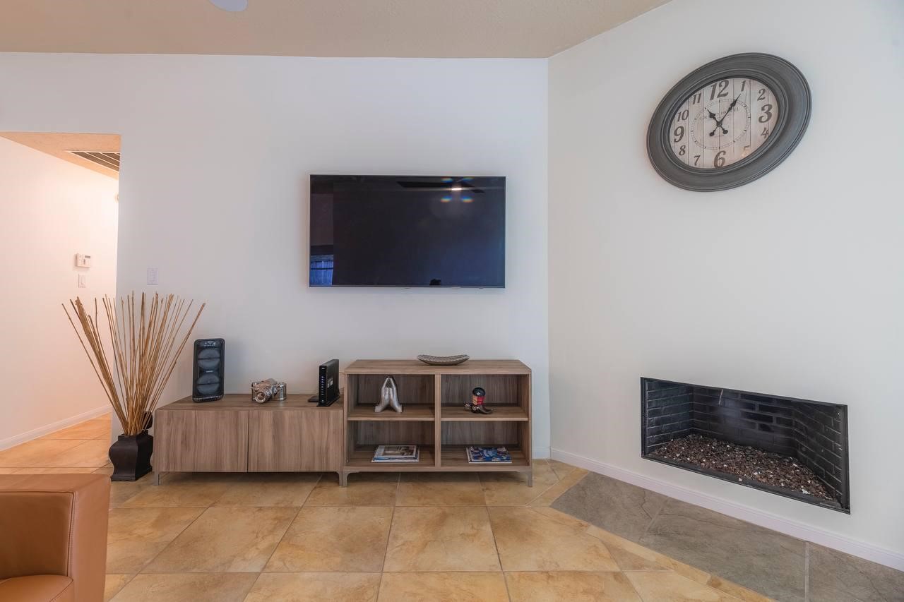 6 Avenswood Place Spring, TX 77382 - Photo 17 of 22 a living room with furniture and a flat screen tv