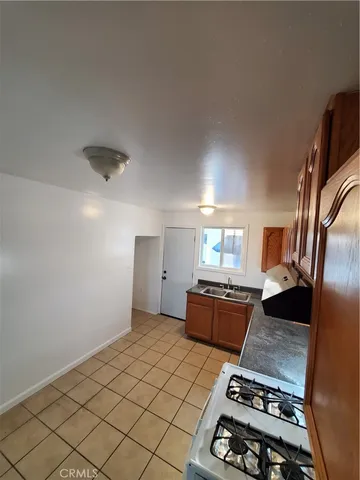 a living room with hard wood flooring and a couch