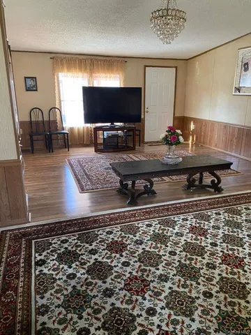 a living room with a couch and a flat screen tv