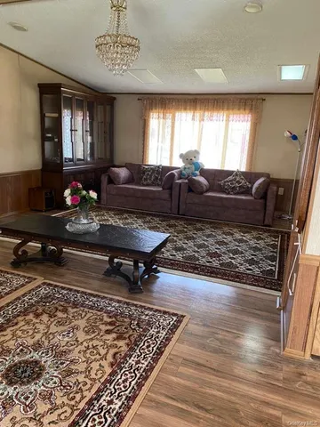 a living room with lots of furniture and a rug