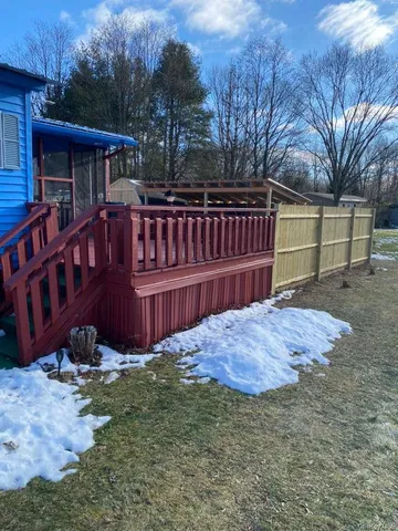 a view of a backyard with a small cabin