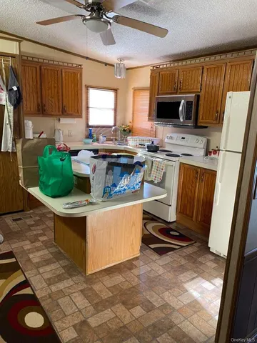 a living room with a couch and a stove top oven