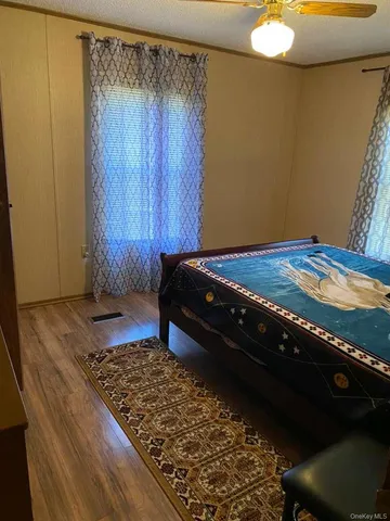 a bedroom with a bed and cabinets