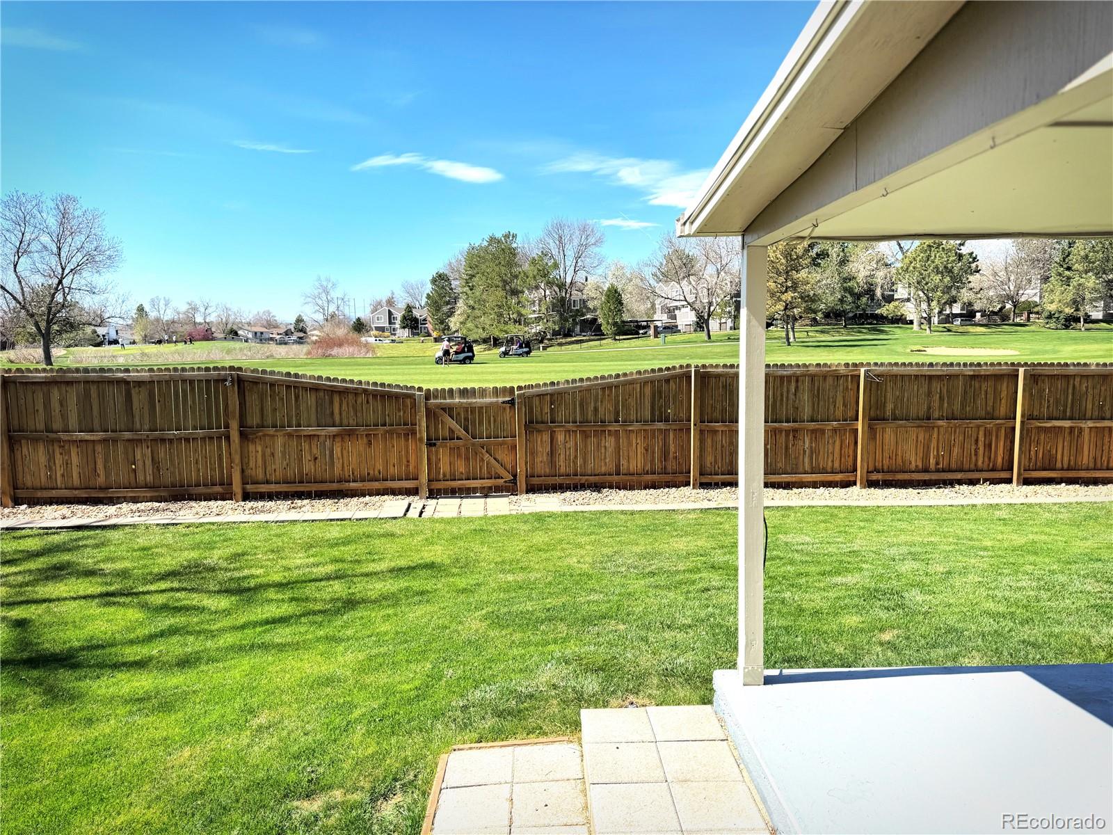 8403 Chase Drive Arvada, CO 80003 - Photo 12 of 39 a view of a backyard with a garden and plants