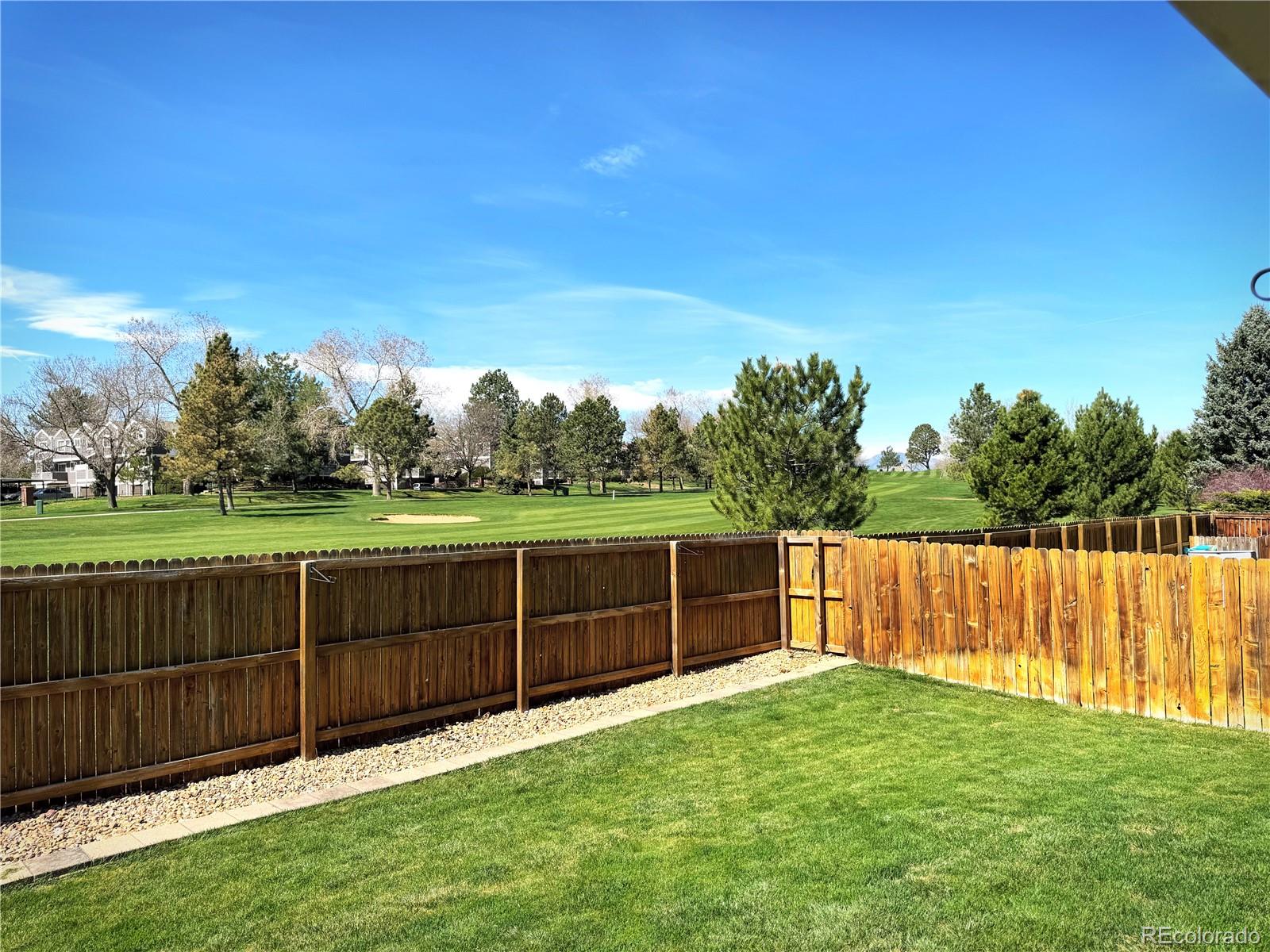 8403 Chase Drive Arvada, CO 80003 - Photo 13 of 39 a view of a backyard with wooden fence