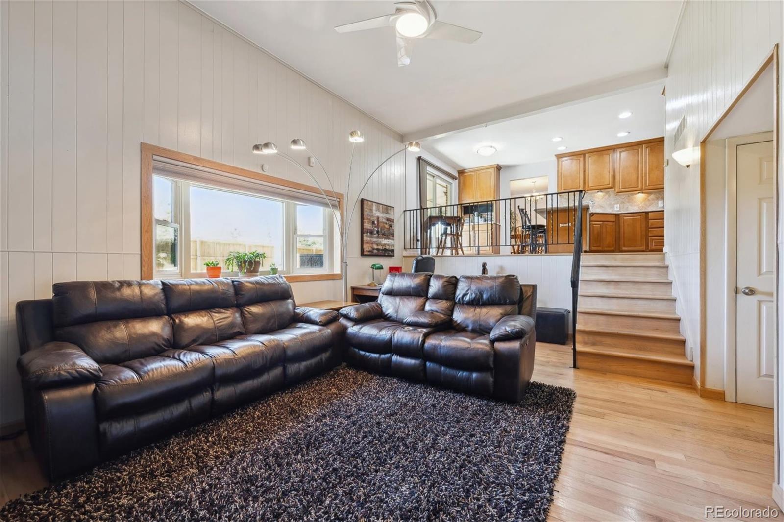 8403 Chase Drive Arvada, CO 80003 - Photo 17 of 39 a living room with furniture and a wooden floor