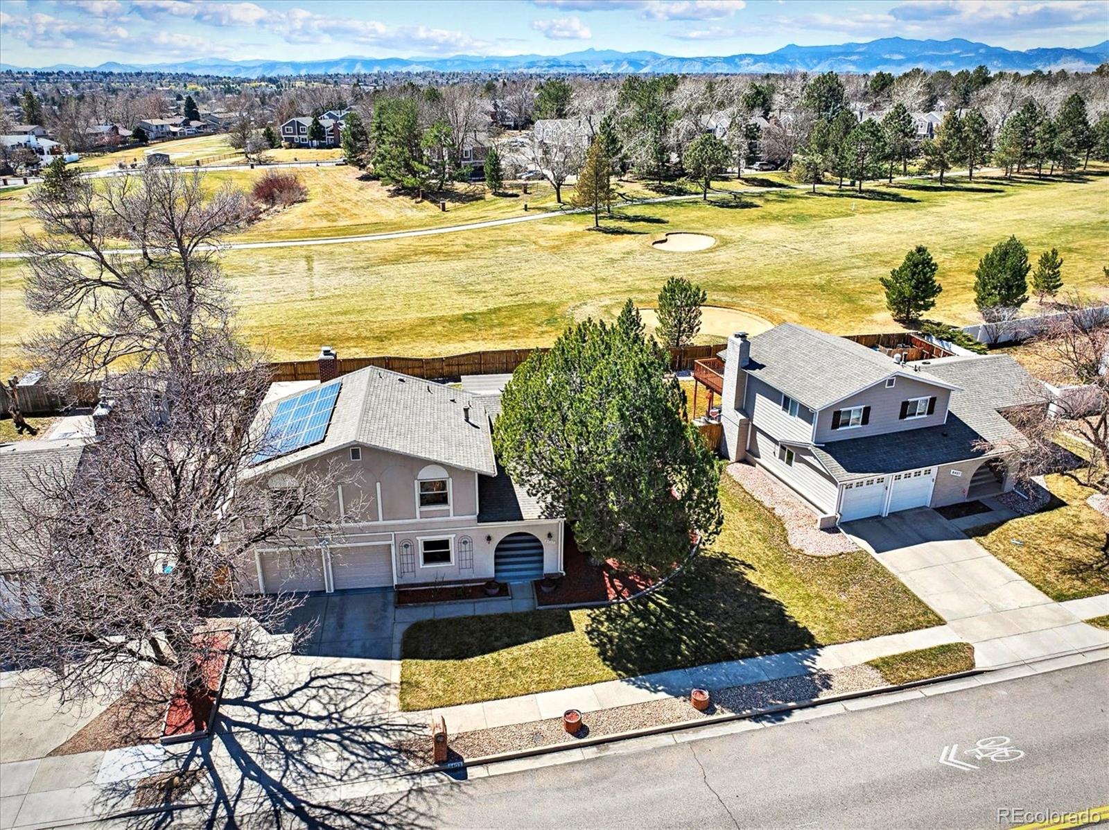 8403 Chase Drive Arvada, CO 80003 - Photo 2 of 39 a view of a house with pool and ocean view