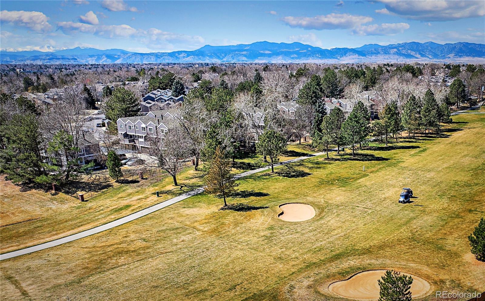 8403 Chase Drive Arvada, CO 80003 - Photo 25 of 39 a view of a swimming pool with a table and chairs