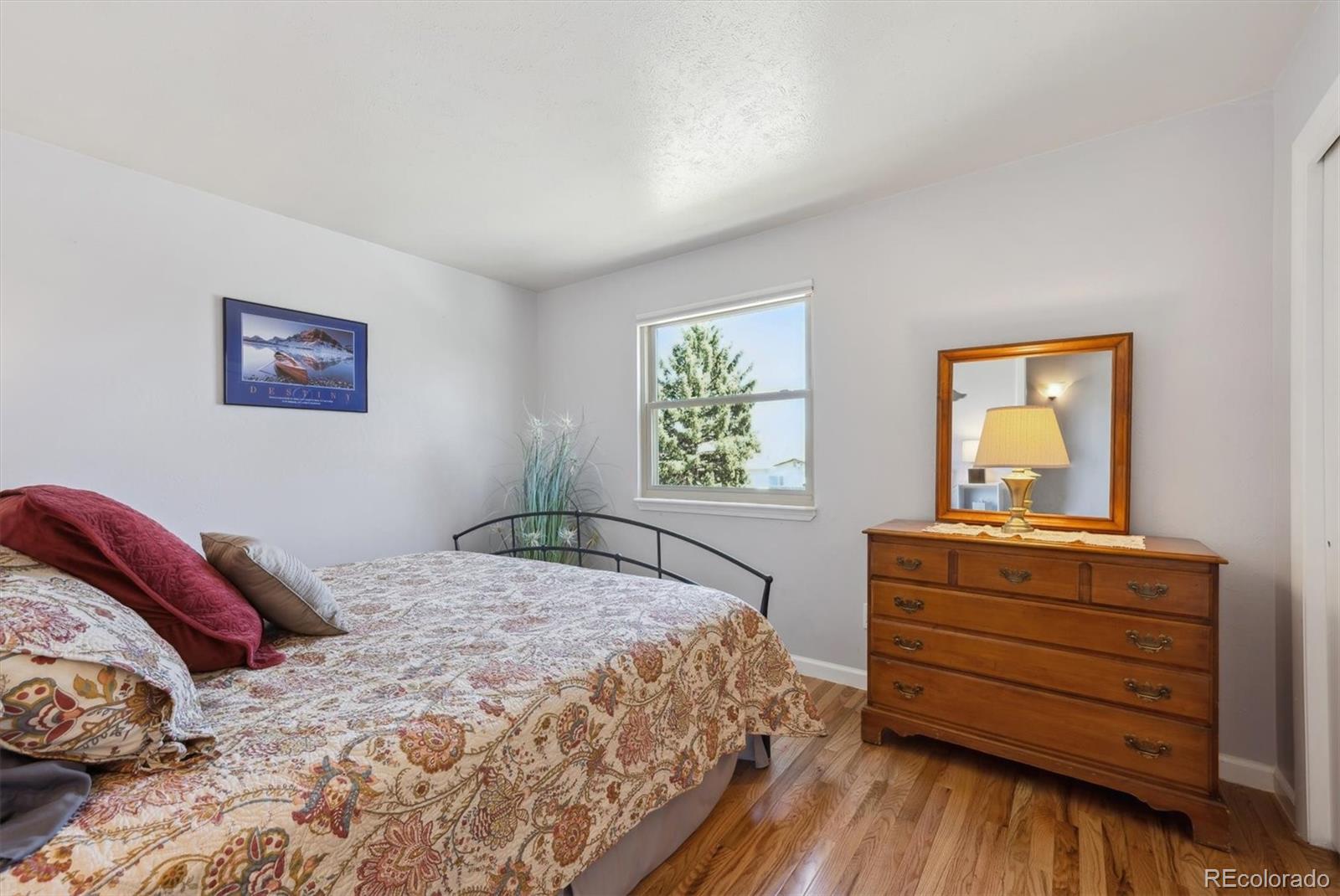 8403 Chase Drive Arvada, CO 80003 - Photo 29 of 39 a bedroom with a bed and a window