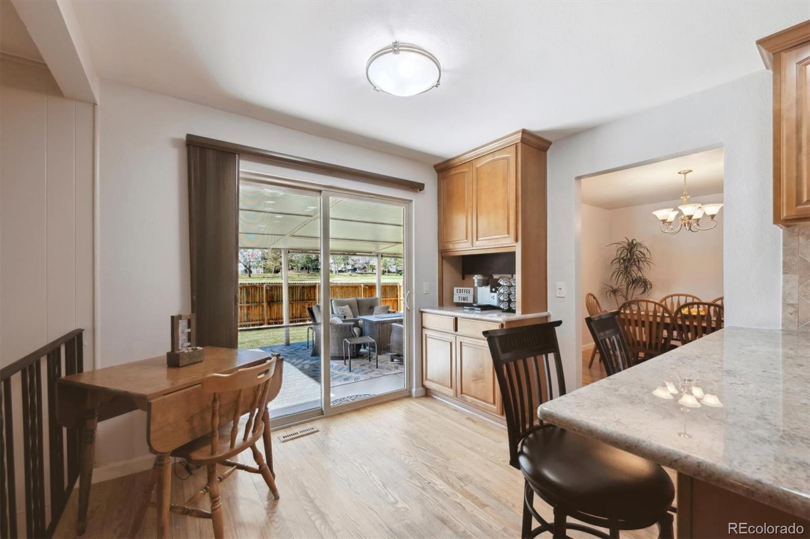 8403 Chase Drive Arvada, CO 80003 - Photo 9 of 39 a view of a dining room with furniture window and outside view