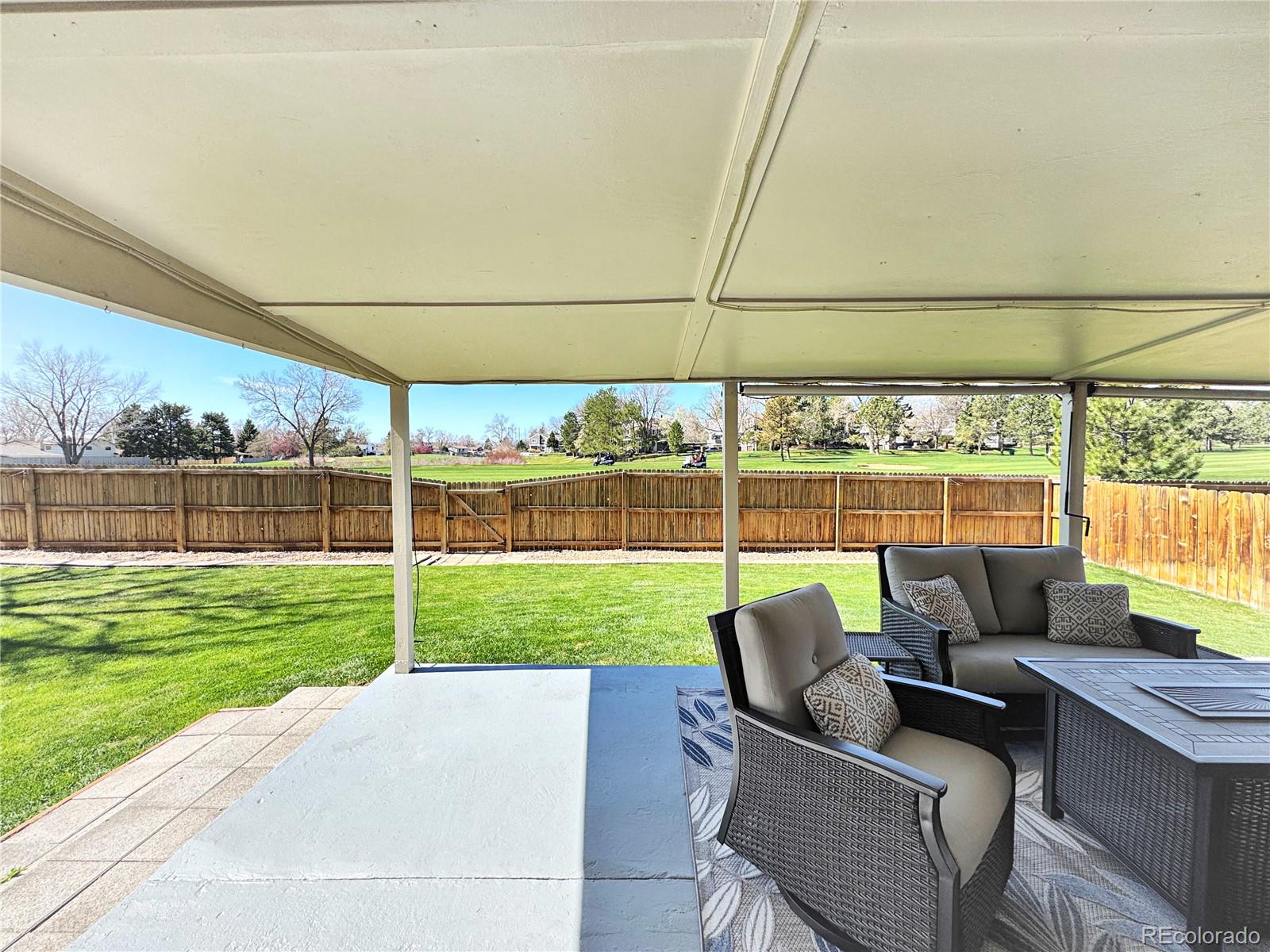 8403 Chase Drive Arvada, CO 80003 - Photo 10 of 39 a view of a patio with couches chairs and a yard