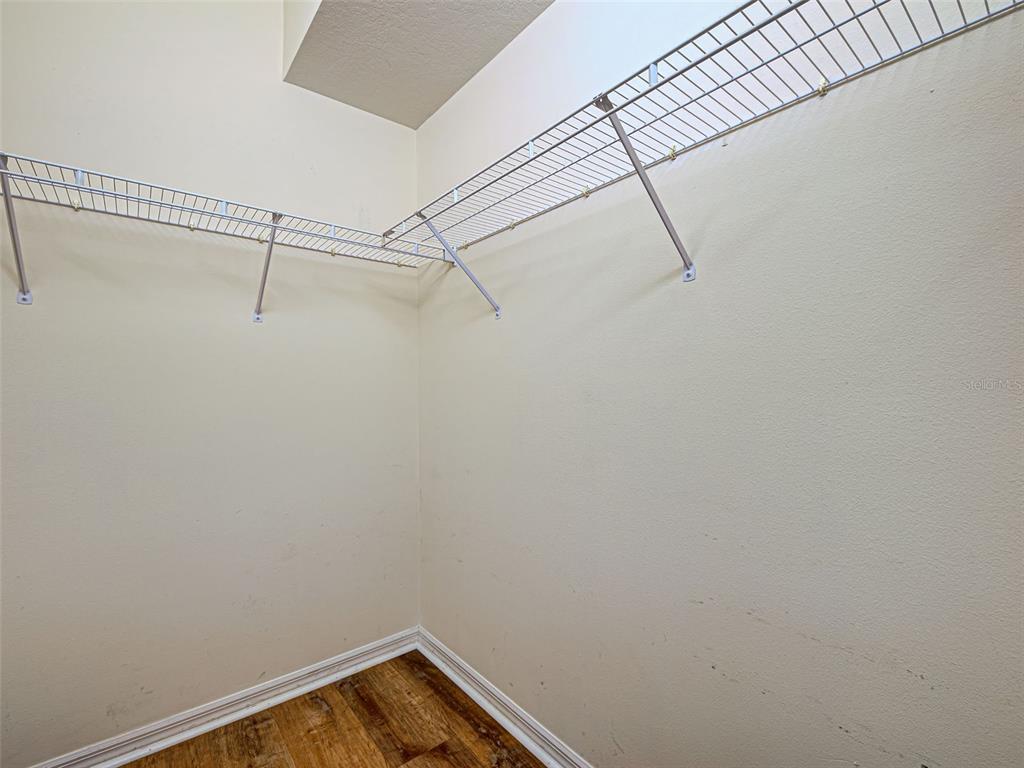 1801 Highland Road Osprey, FL 34229 - Photo 25 of 40 a view of a room with racks on the wall