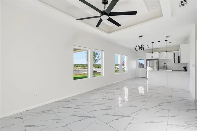 a view of a livingroom with window and furniture