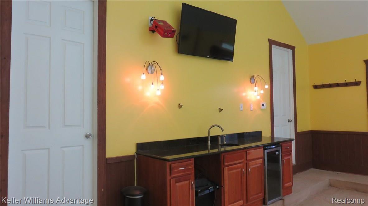 6487 North Beck Road Canton, MI 48187 - Photo 31 of 41 Wet bar and media wall in pool house