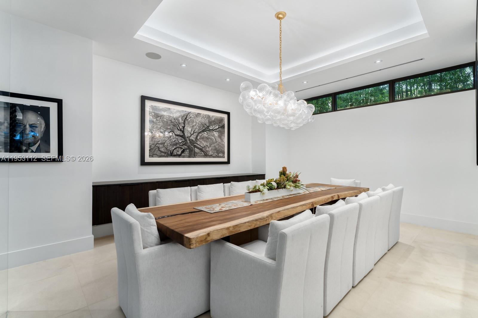 6031 Southwest 88th Street Miami, FL 33156 - Photo 14 of 81 a view of a dining room with a table and chairs