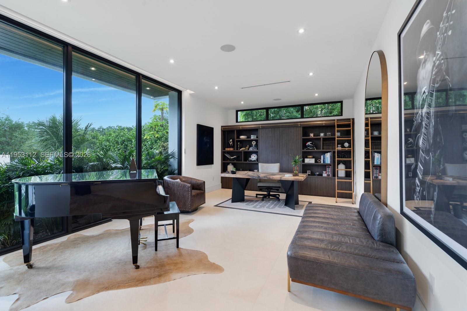 6031 Southwest 88th Street Miami, FL 33156 - Photo 19 of 81 a living room with furniture and large windows