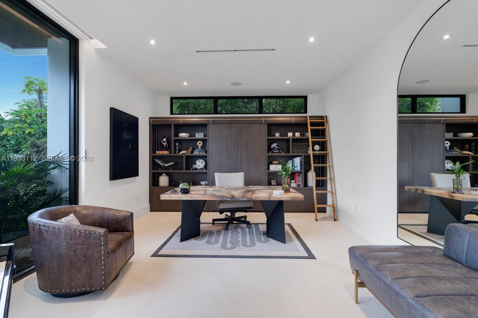 6031 Southwest 88th Street Miami, FL 33156 - Photo 20 of 81 a living room with furniture a rug and a potted plant