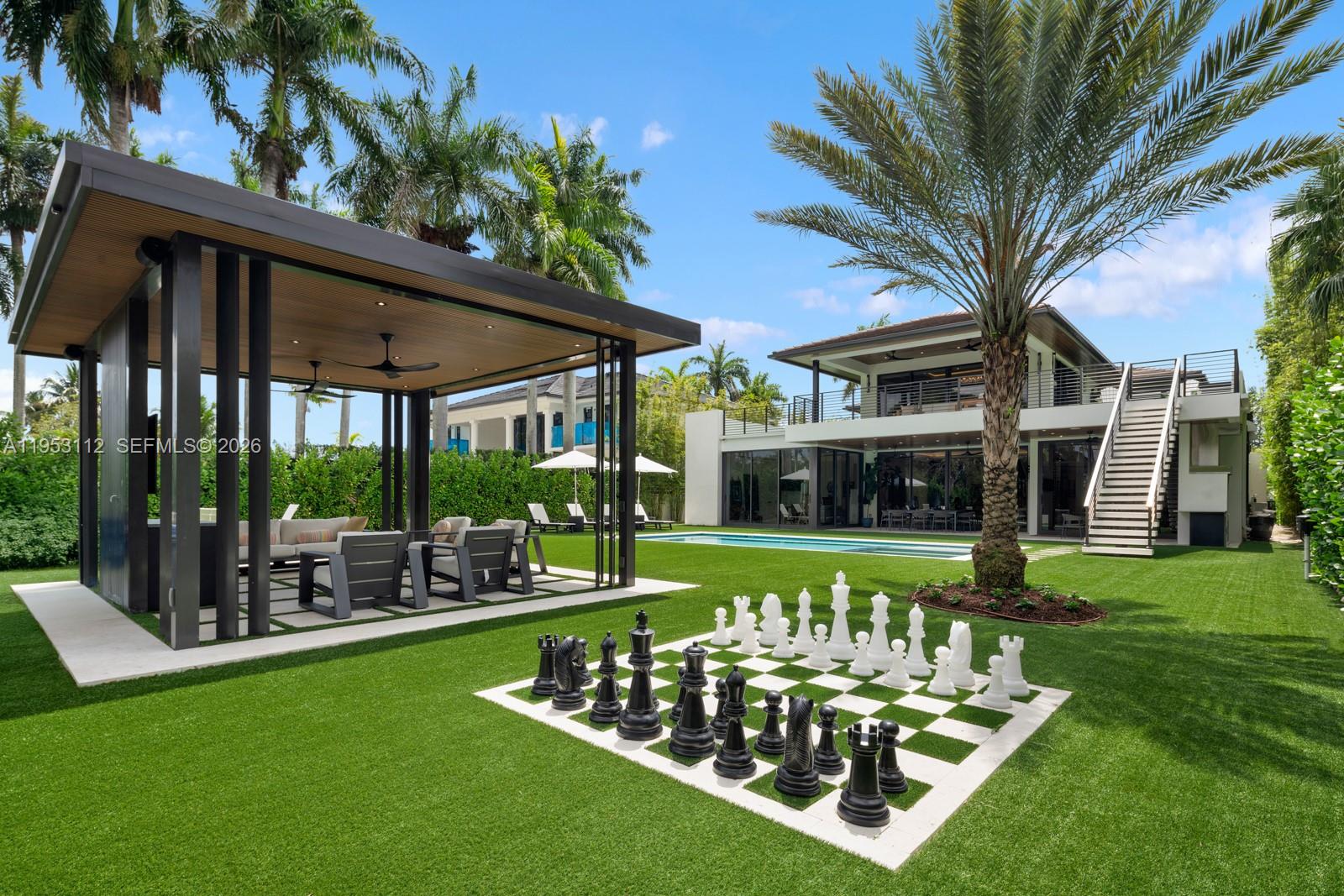 6031 Southwest 88th Street Miami, FL 33156 - Photo 2 of 81 a front view of a house with garden