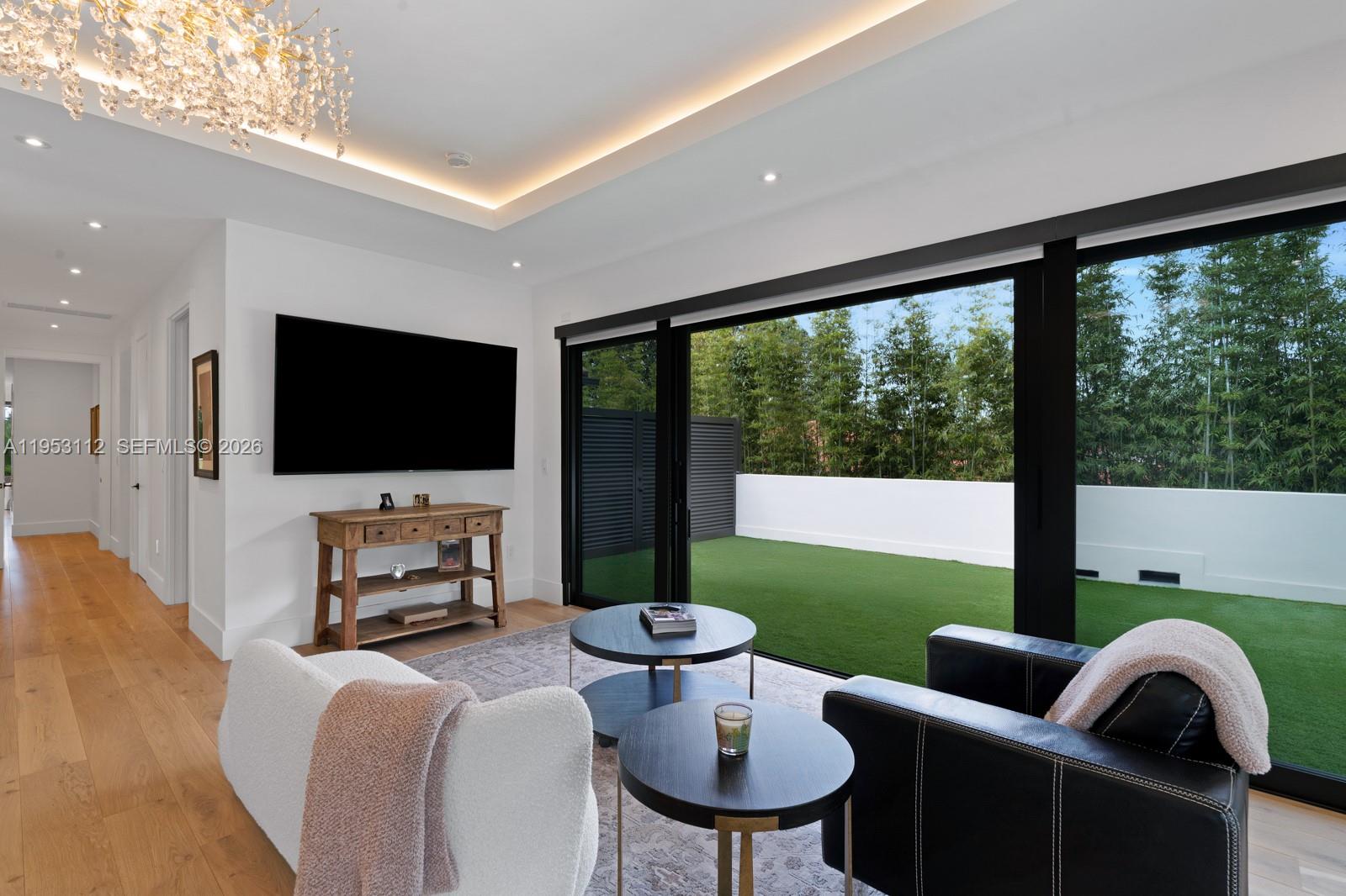 6031 Southwest 88th Street Miami, FL 33156 - Photo 29 of 81 a living room with furniture and a flat screen tv