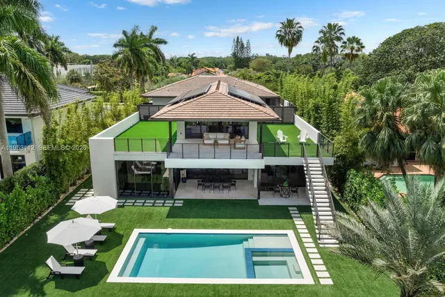 a view of a dining room with a table and chairs